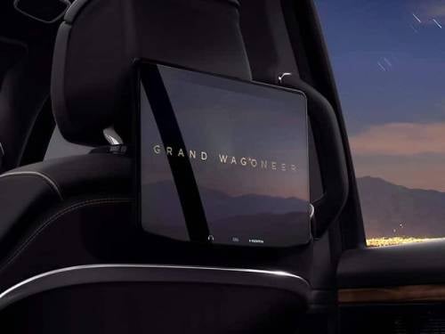 2024 Grand Wagoneer close up view of rear entertainment screen on headrest of front seat